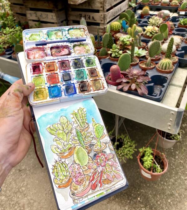 Cuaderno y acuarelas sobre los cactus del vivero Eden Garden de Dos Hermanas
